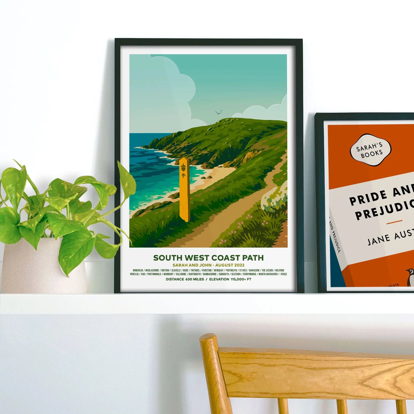 Framed print on shelf beside houseplant