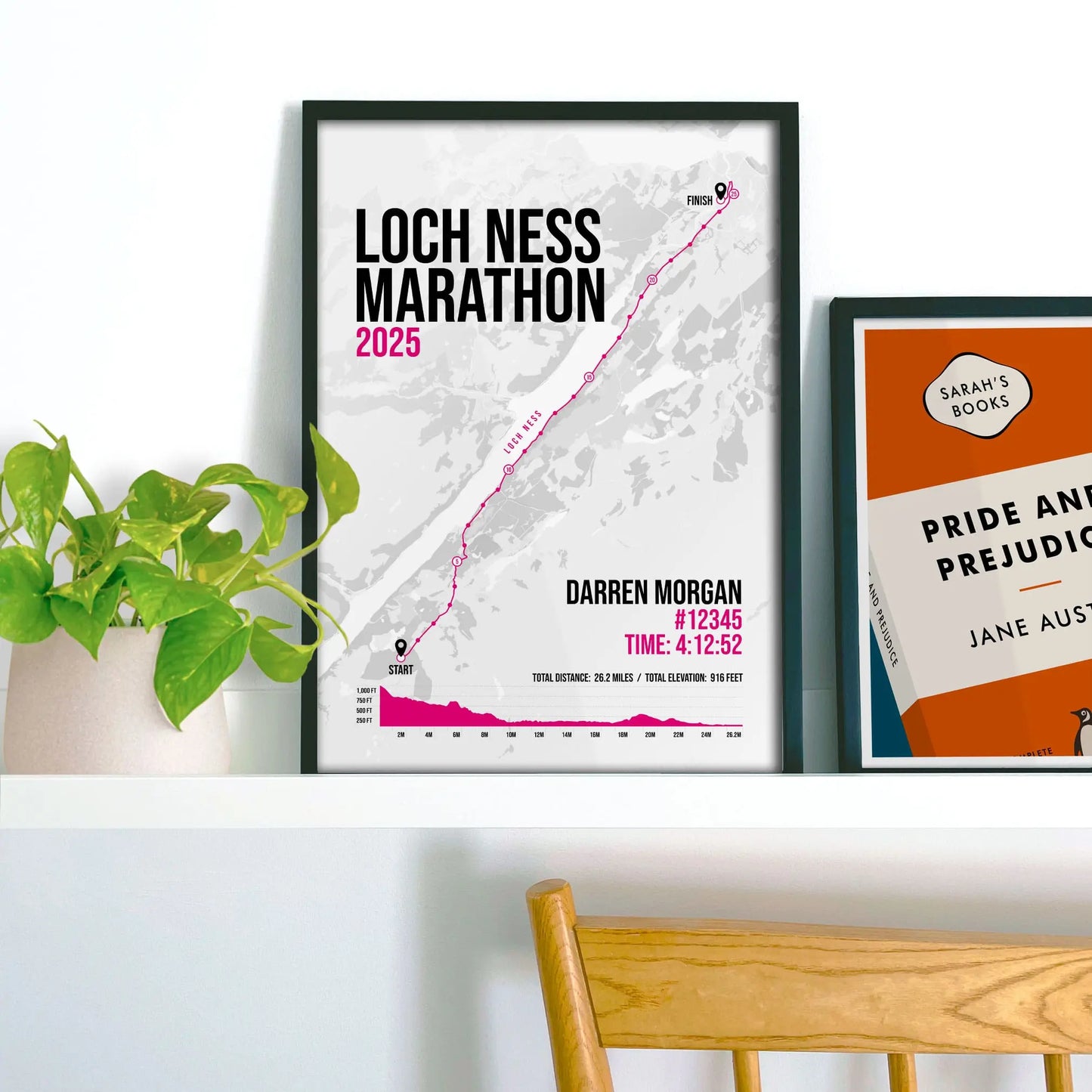 Framed print on shelf beside houseplant