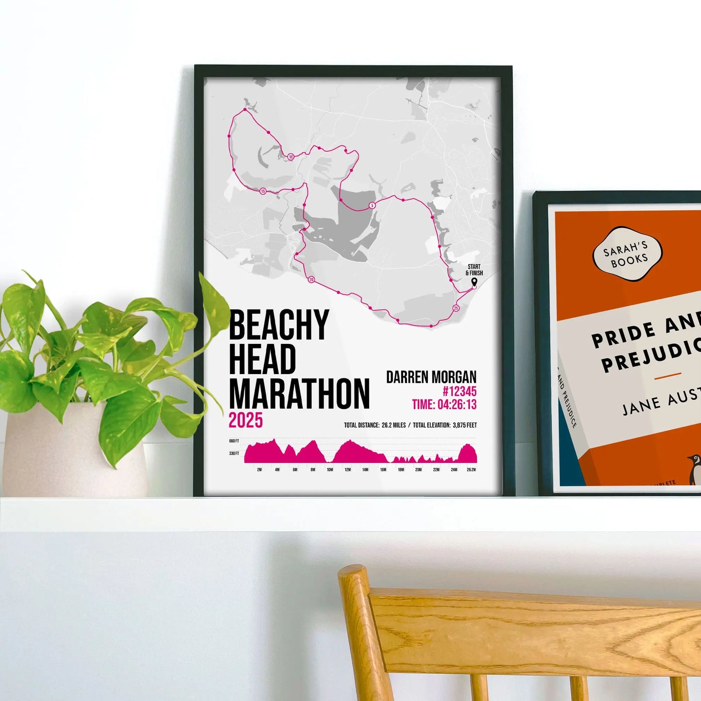 Print on frame shelf beside houseplant