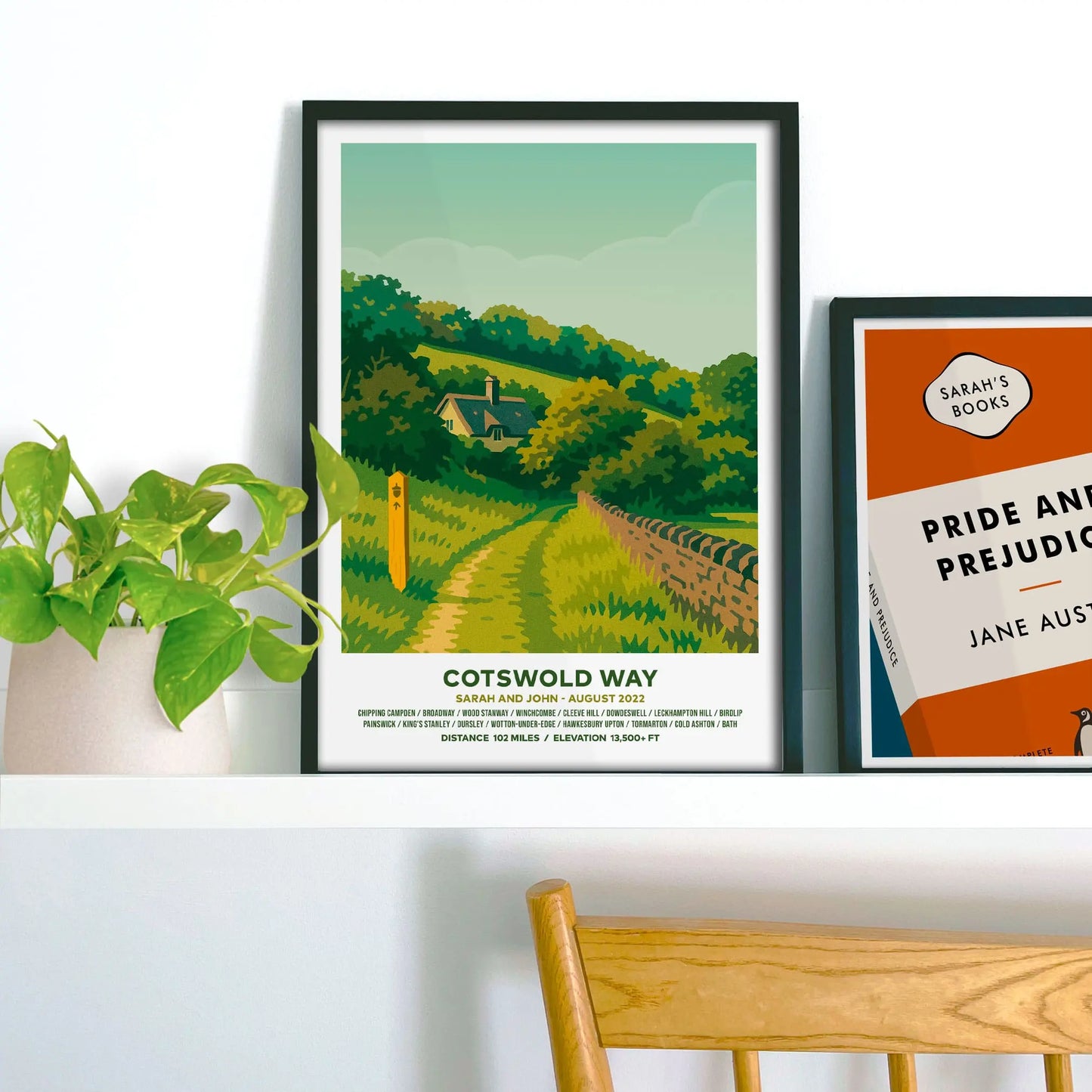Framed print on shelf beside houseplant