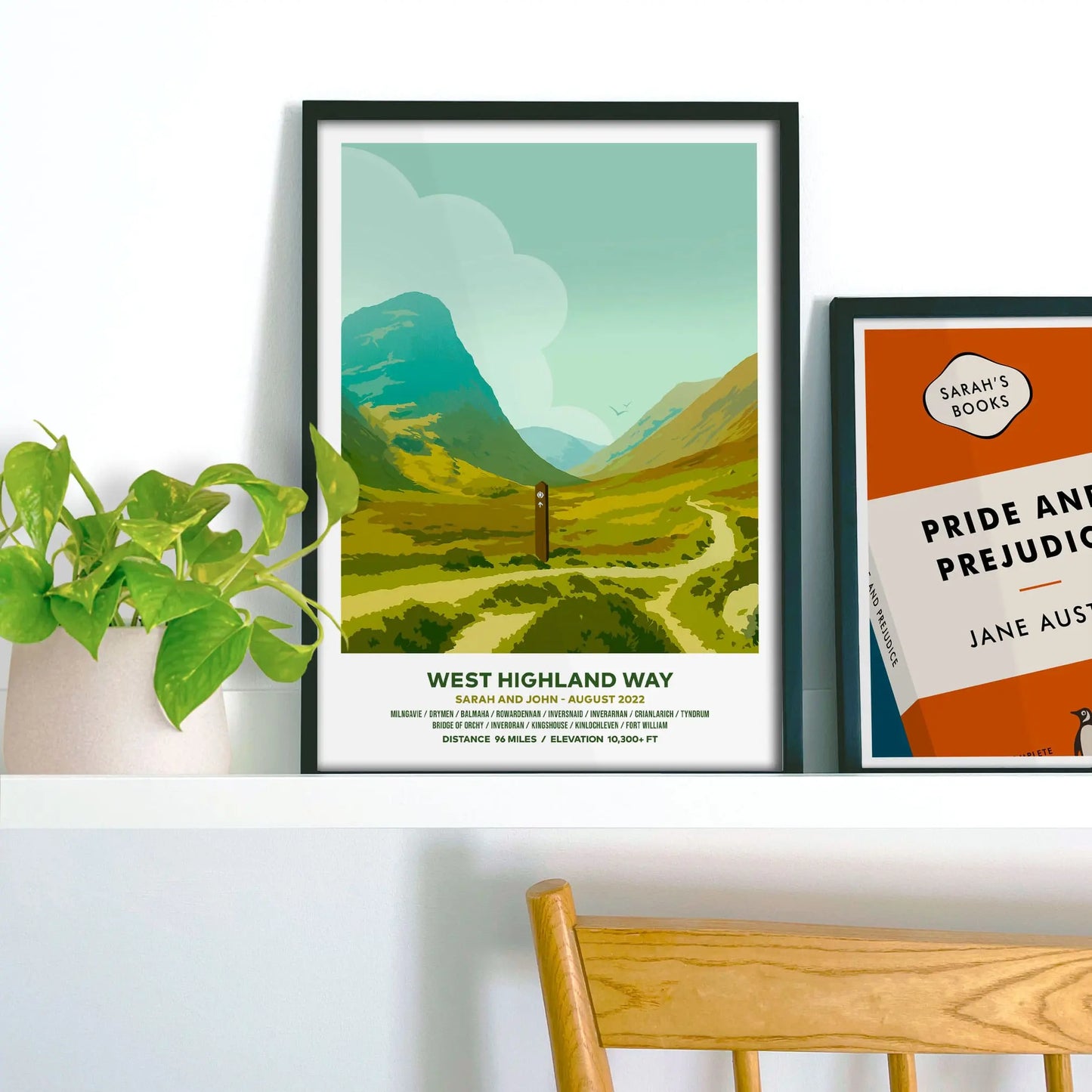 Framed print on shelf beside houseplant