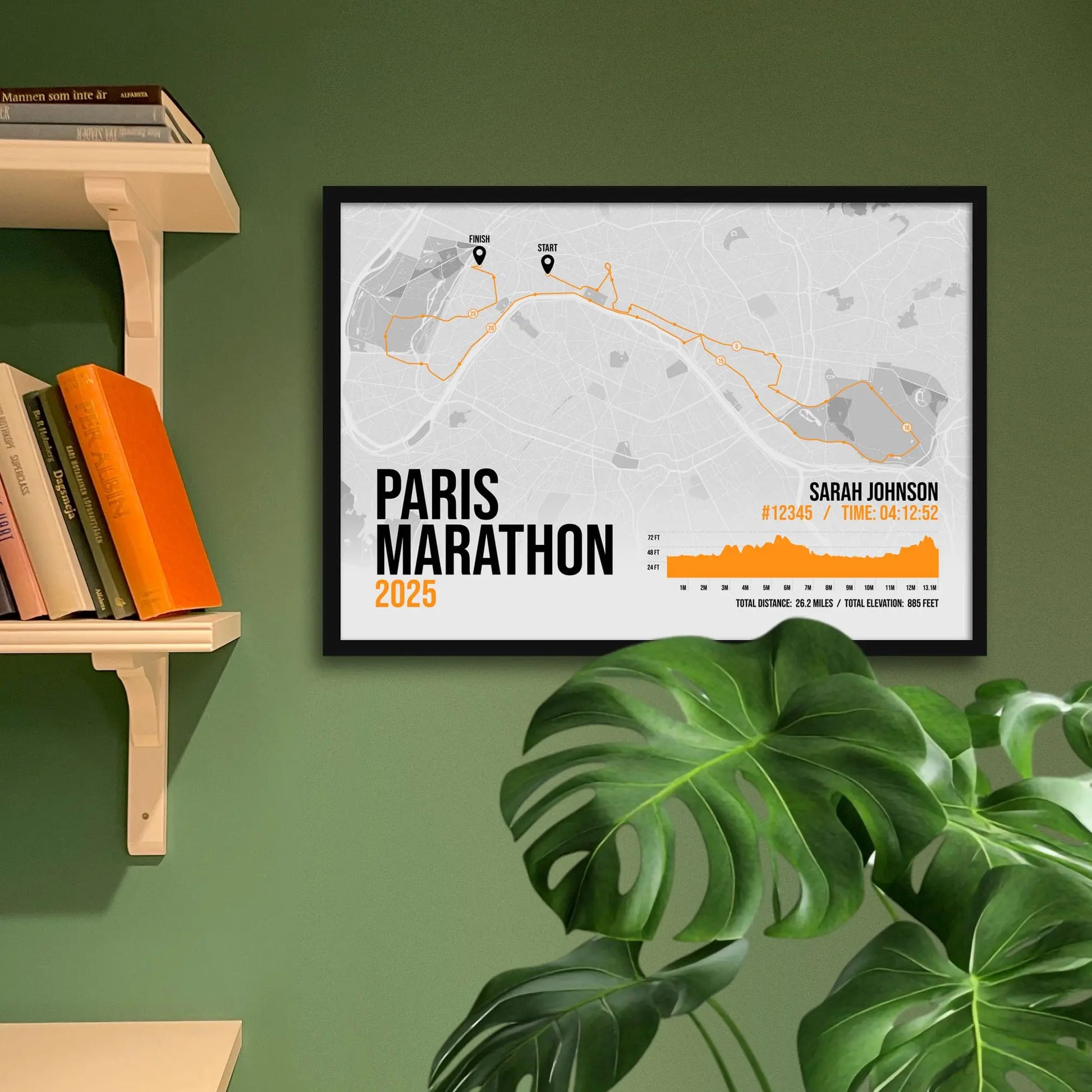 Framed art print on a green wall beside shelves.