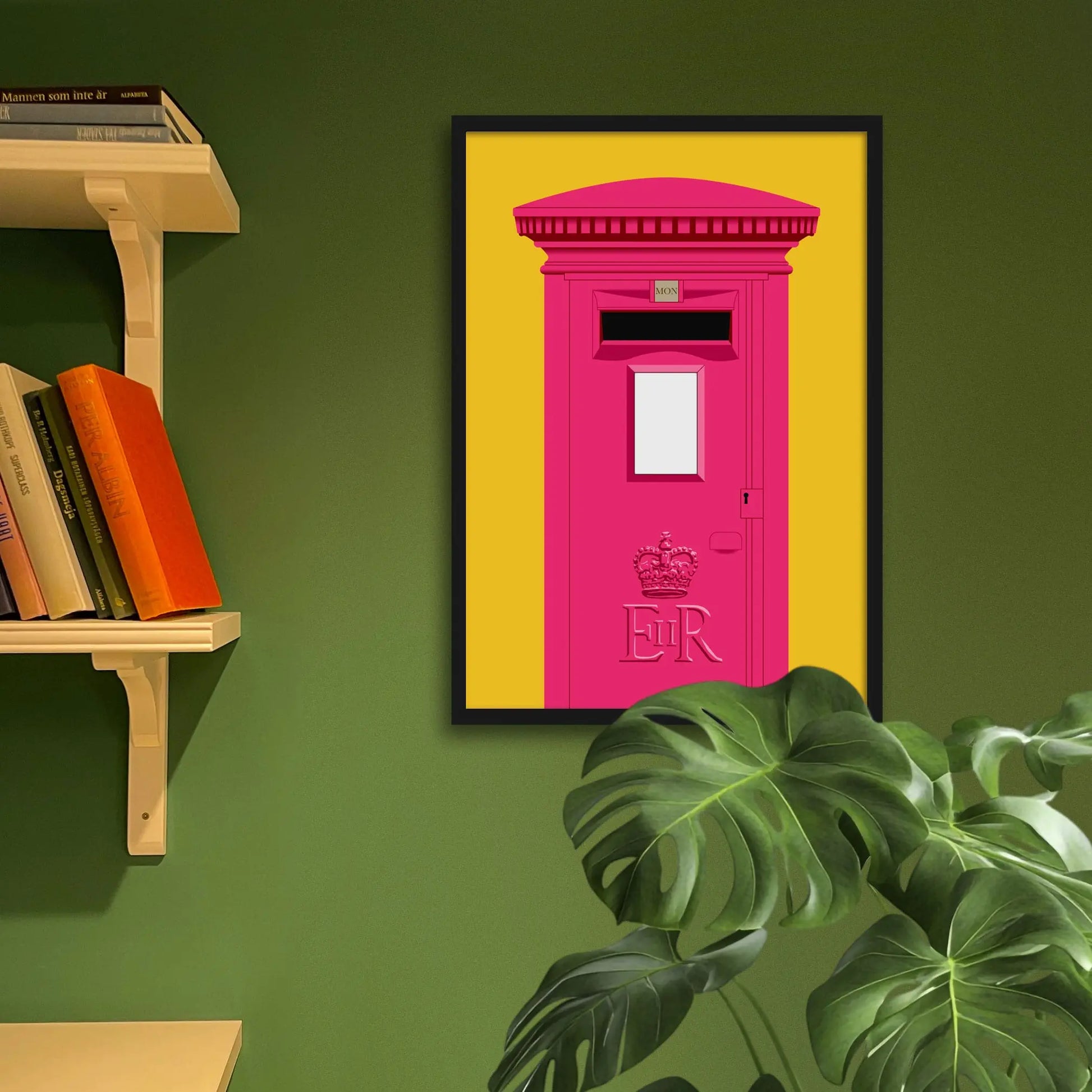 Framed art print on a green wall beside shelves.