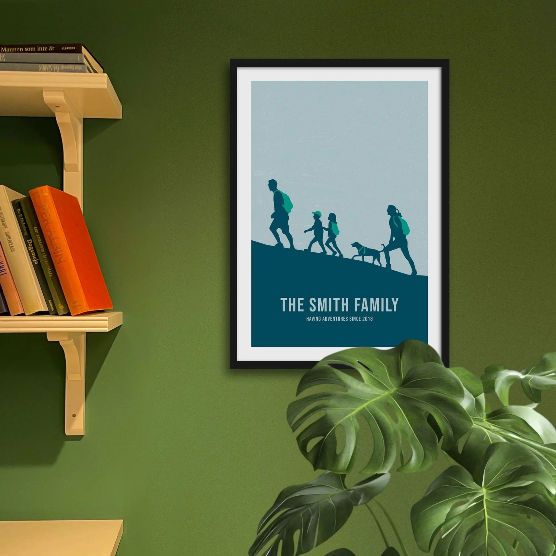 Framed art print on a green wall beside shelves.
