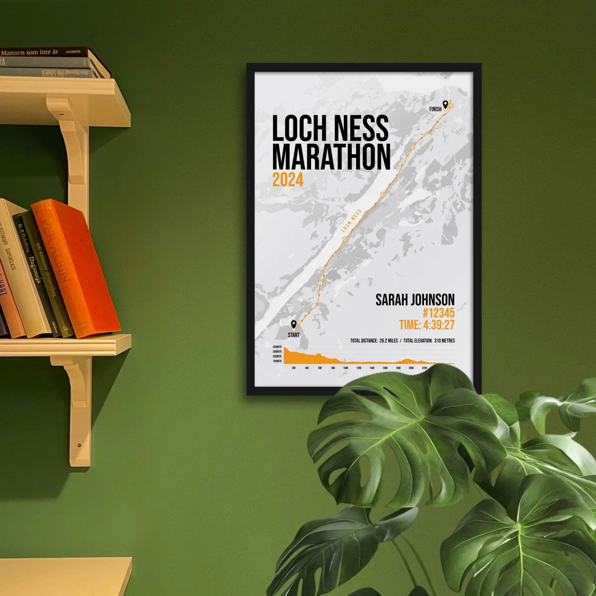 Framed art print on a green wall beside shelves.