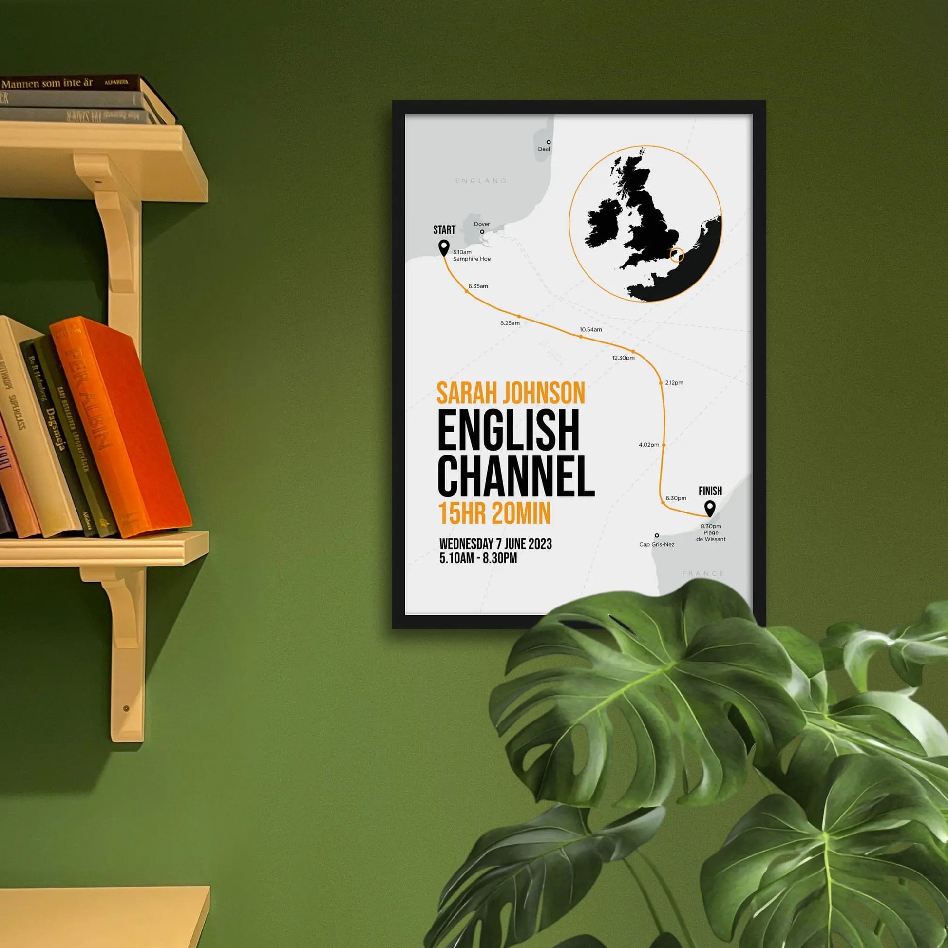 Framed art print on a green wall beside shelves.