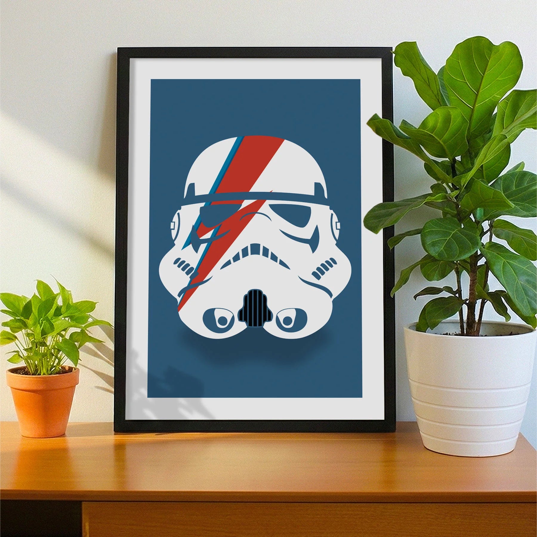 Print laying on table with speckled shade cast across the surface