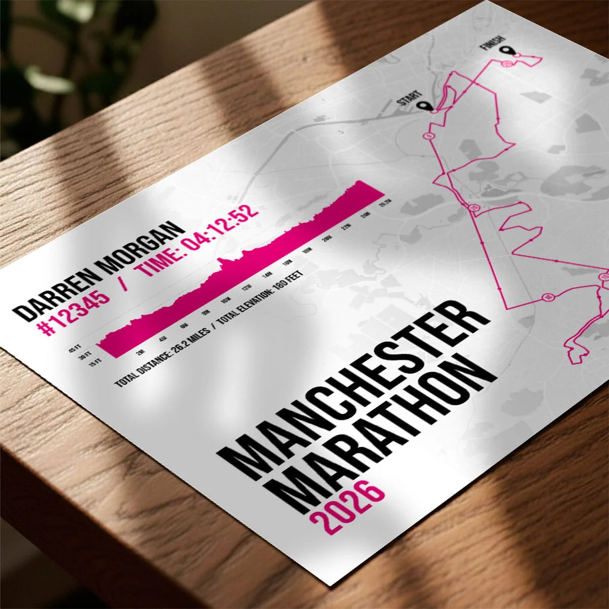 Personalised marathon print laying on wooden table top