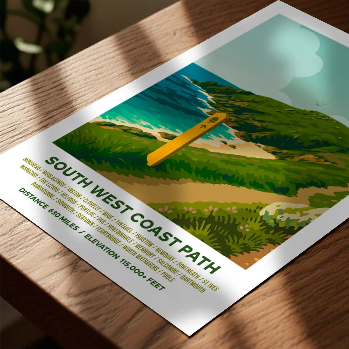 Print laying on table with speckled shade cast across the surface