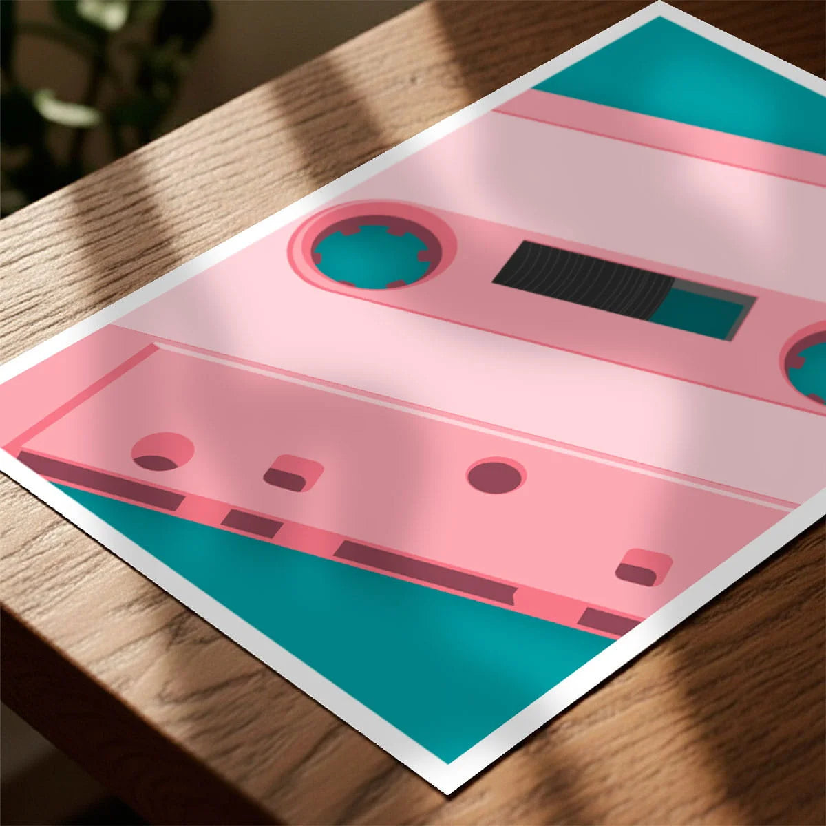 Print laying on table with speckled shade cast across the surface