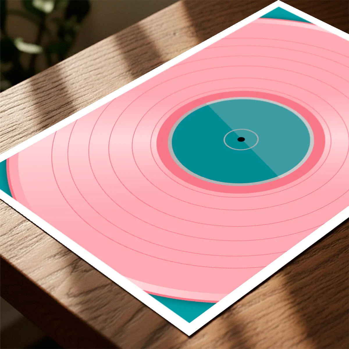 Print laying on table with speckled shade cast across the surface