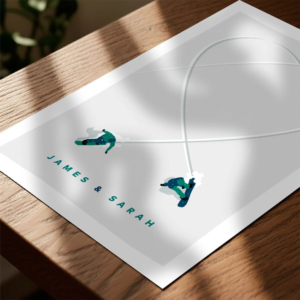 Print laying on table with speckled shade cast across the surface