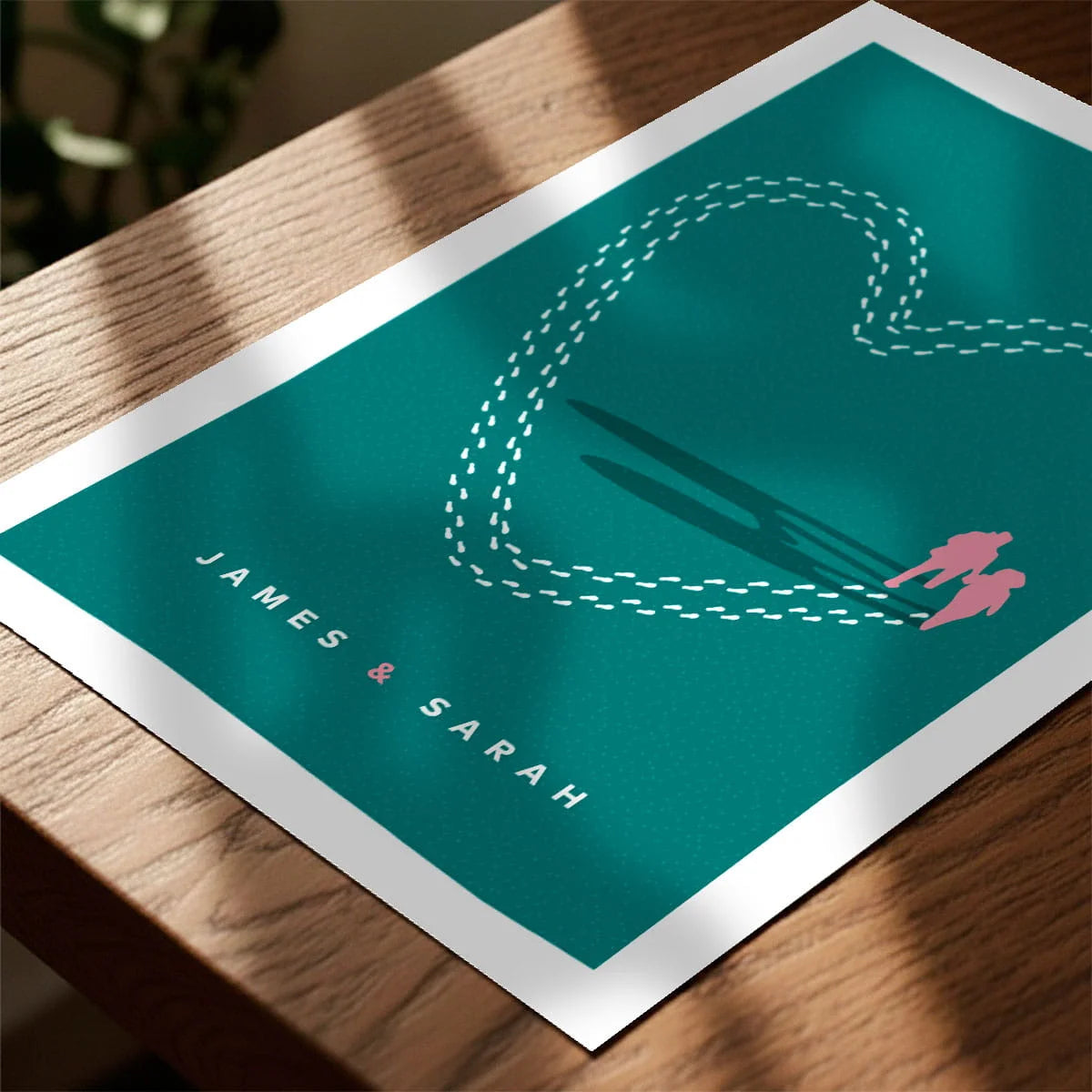 Print laying on table with speckled shade cast across the surface